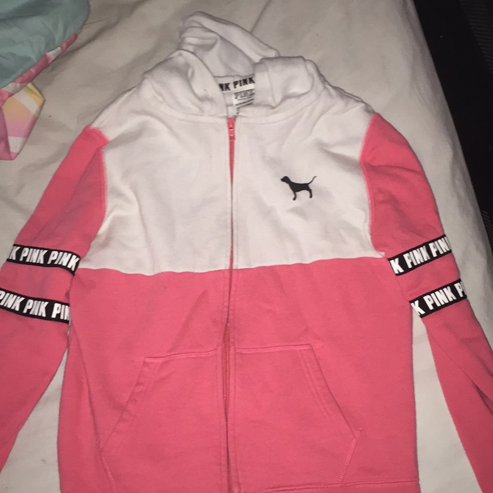 A pink zip up sweatshirt